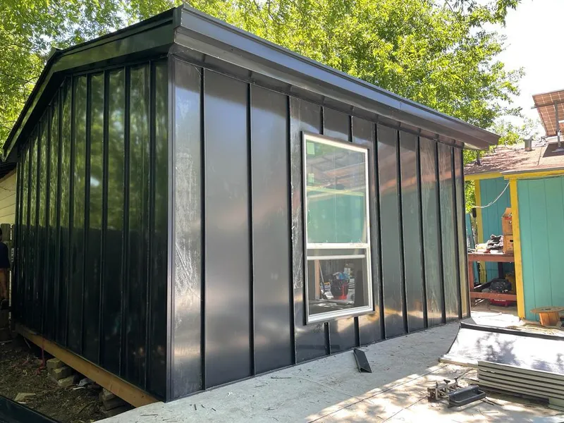 Black standing seam metal wall panels for Roof Inspection in Lee's Summit